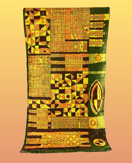Colorful geometric wall carpet in orange/yellow/brown/green