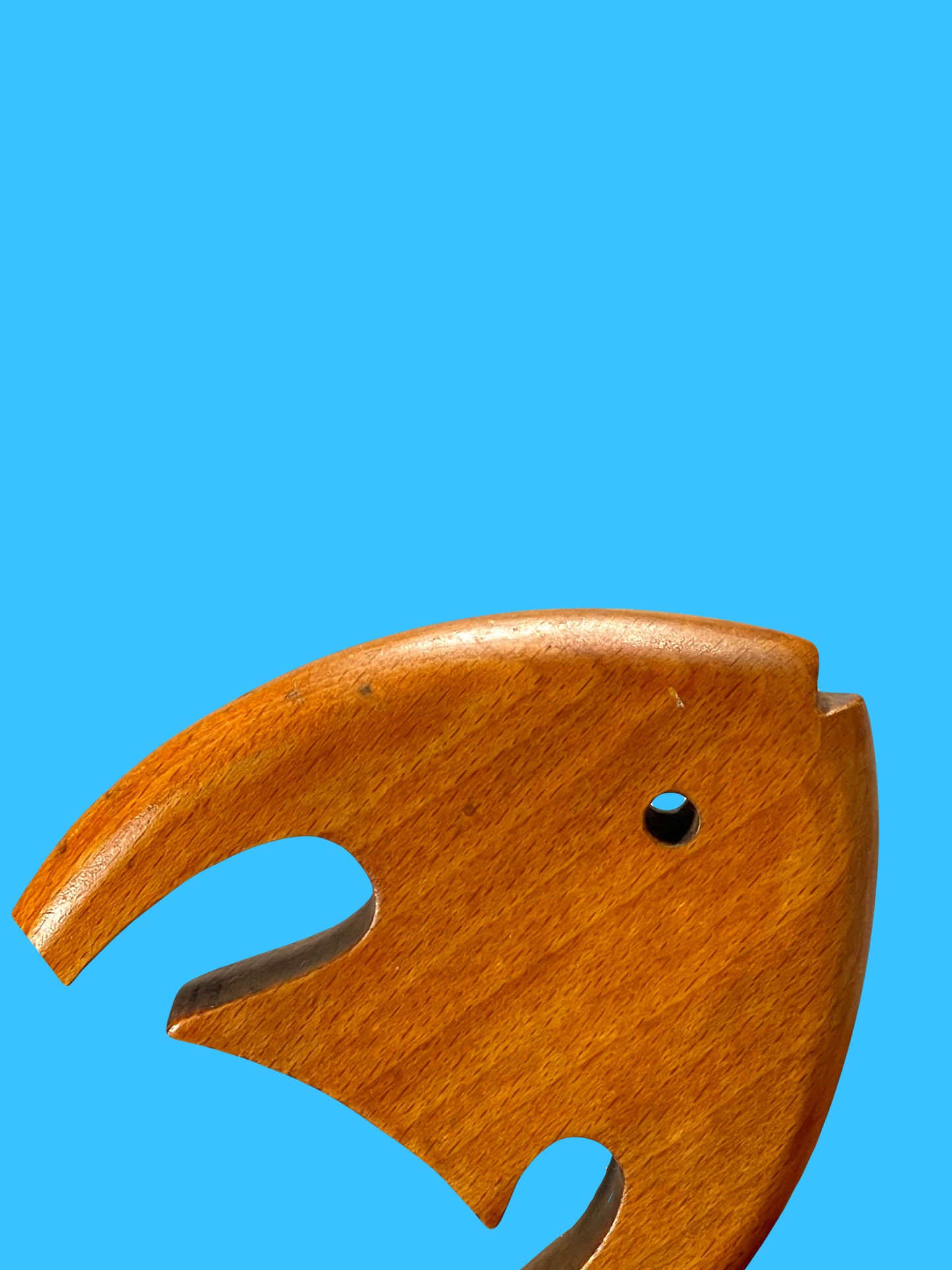 Dynamic matte wooden fish sculpture