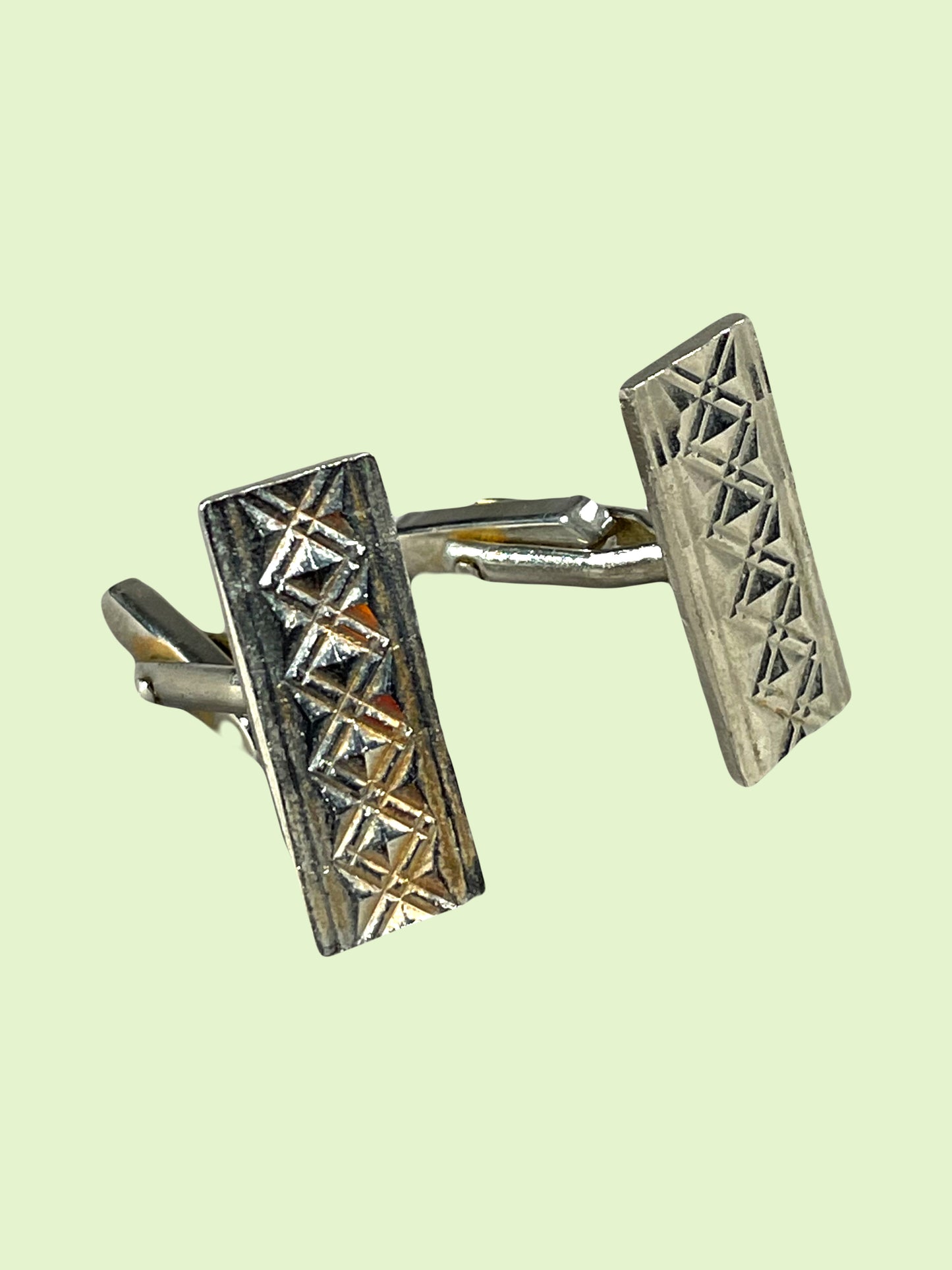 Ornamented rectangular silver metal cufflink