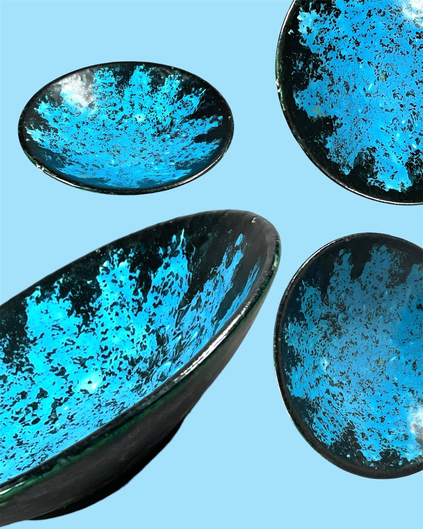 Small black ceramic plate with neon blue decor