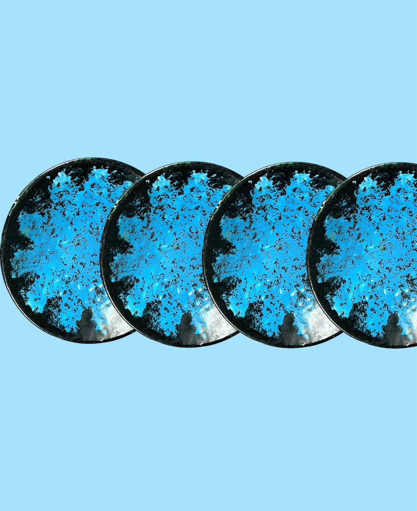 Small black ceramic plate with neon blue decor