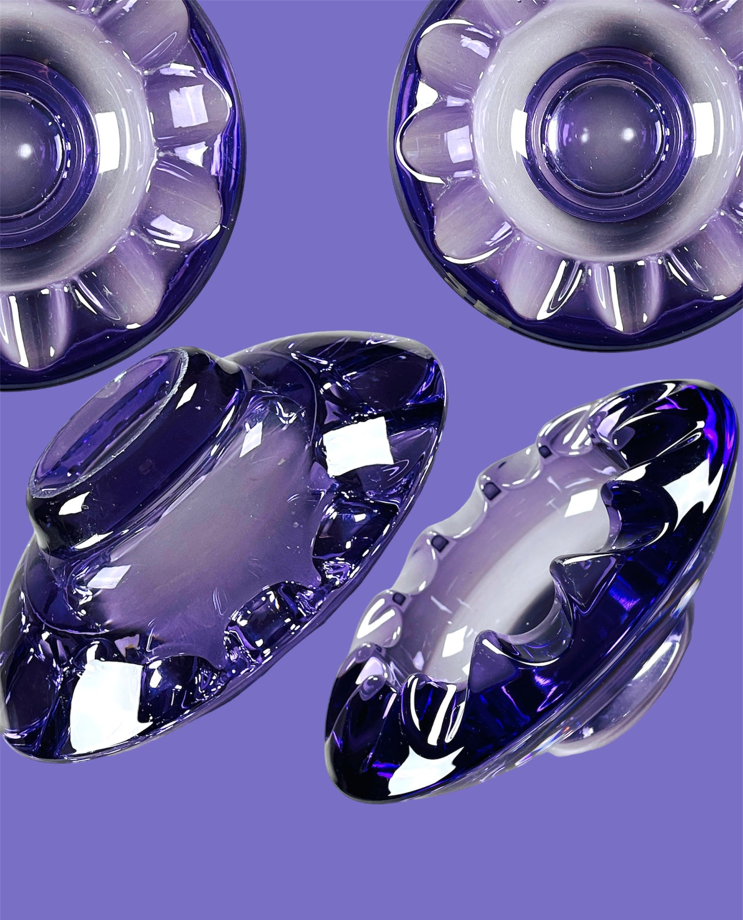 Dynamic pressed glass ashtray in amethyst