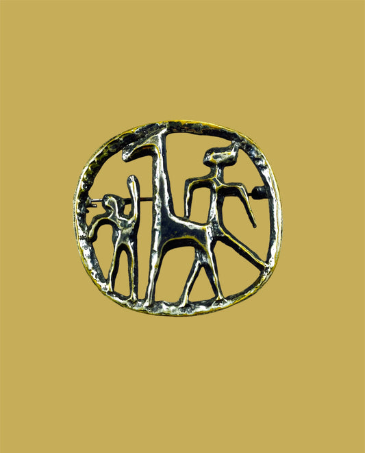 Playful stylized animal with human figures brooch