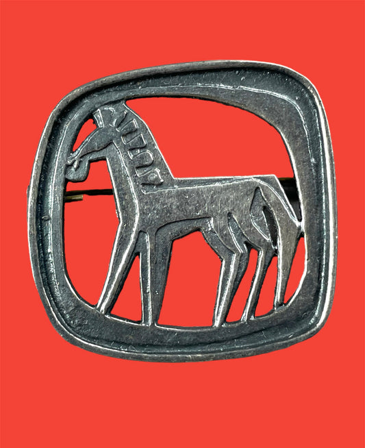 Metal stylized "Colts" brooch