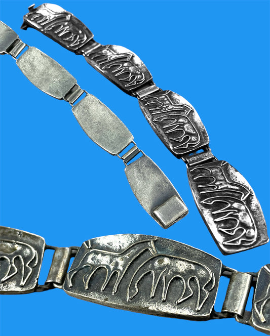 Silver metal bracelet with horses