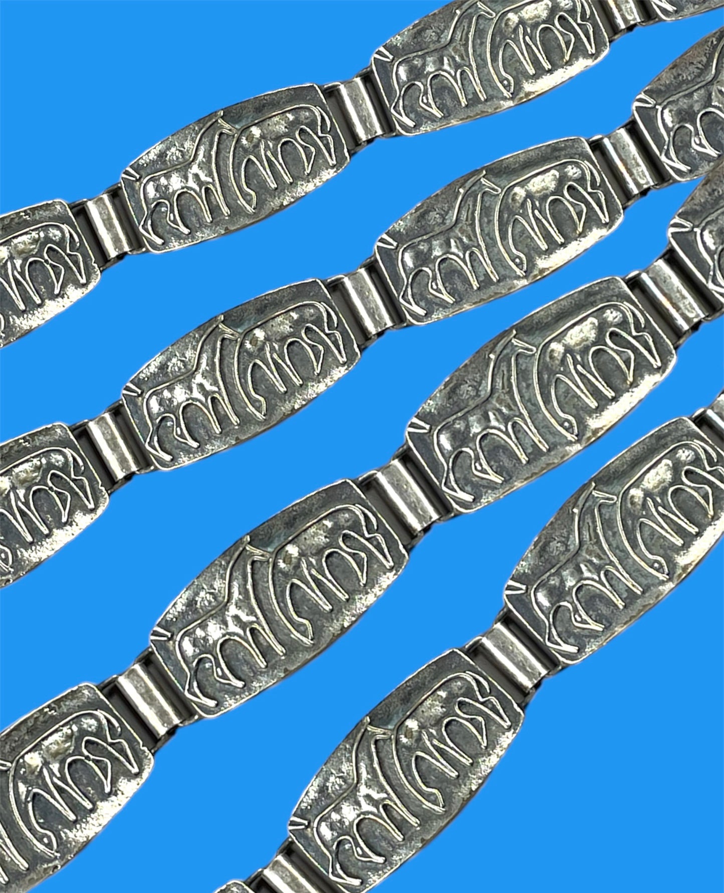 Silver metal bracelet with horses