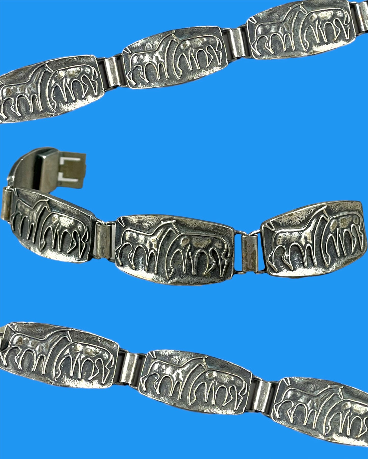 Silver metal bracelet with horses