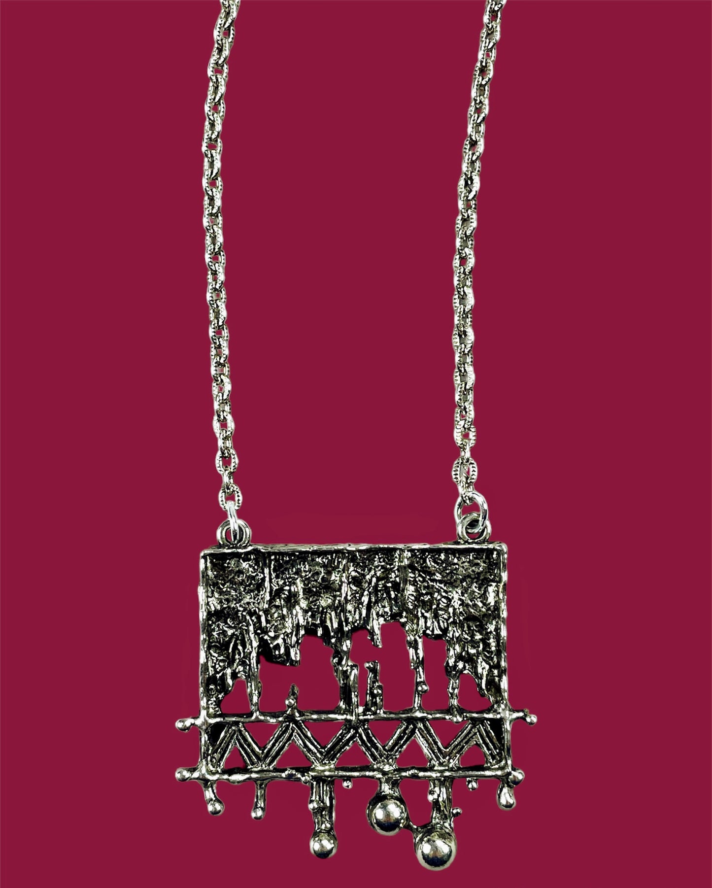 Abstract rectangular silvered metal pendant