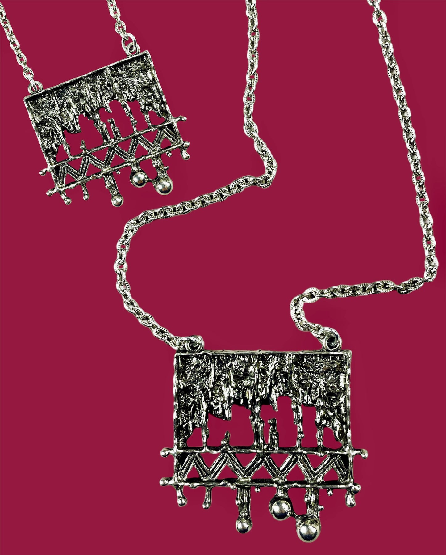 Abstract rectangular silvered metal pendant