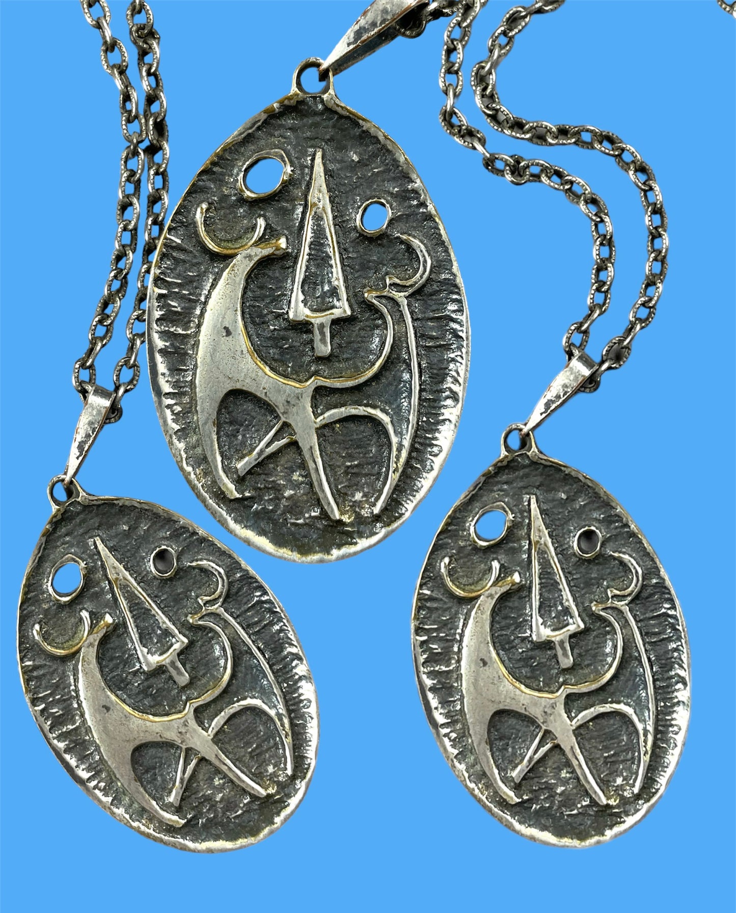 "Deers in the woods" oval silvered metal pendant